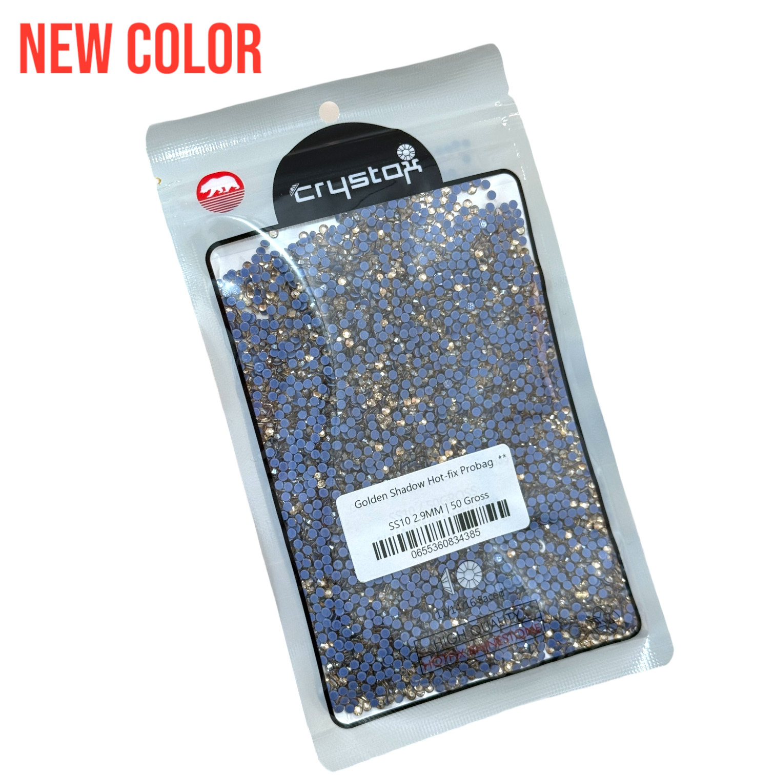 A pack of CrystAX Rhinestones named 'Golden Shadow Hot-fix Pro', displayed in a clear plastic bag, with the product visible as blue and gold colored faceted rhinestones.